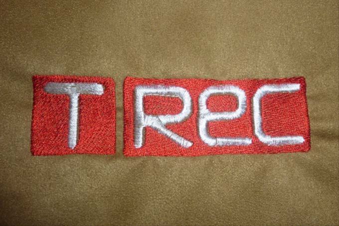 Вышивка логотипа компании TREC
